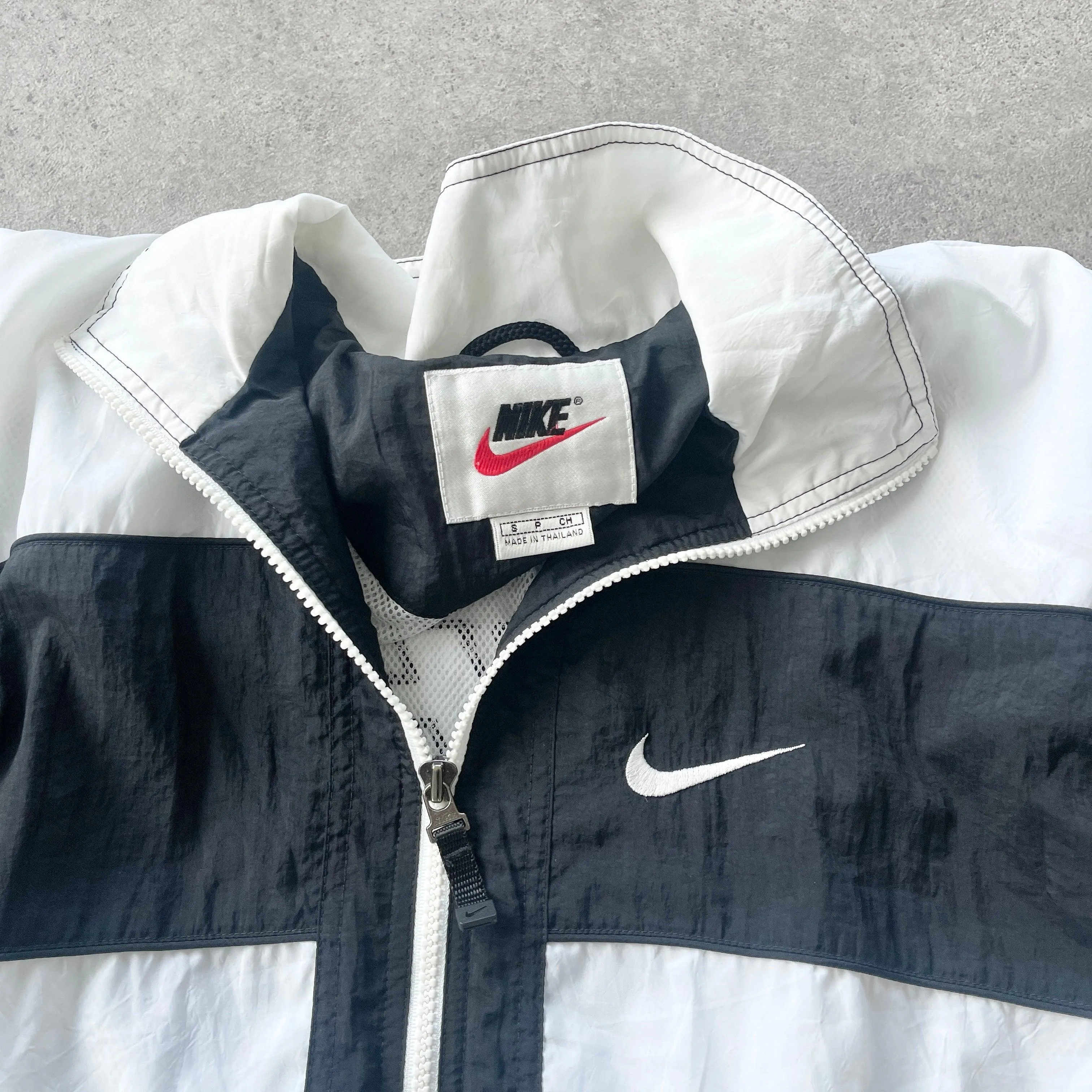 Nike 1990s lightweight convertible spellout shell jacket (S)